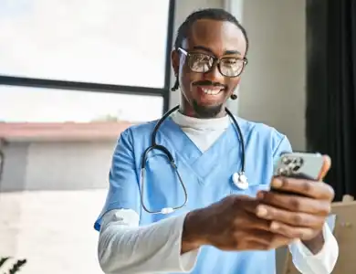Male Nurse On Phone 600X400